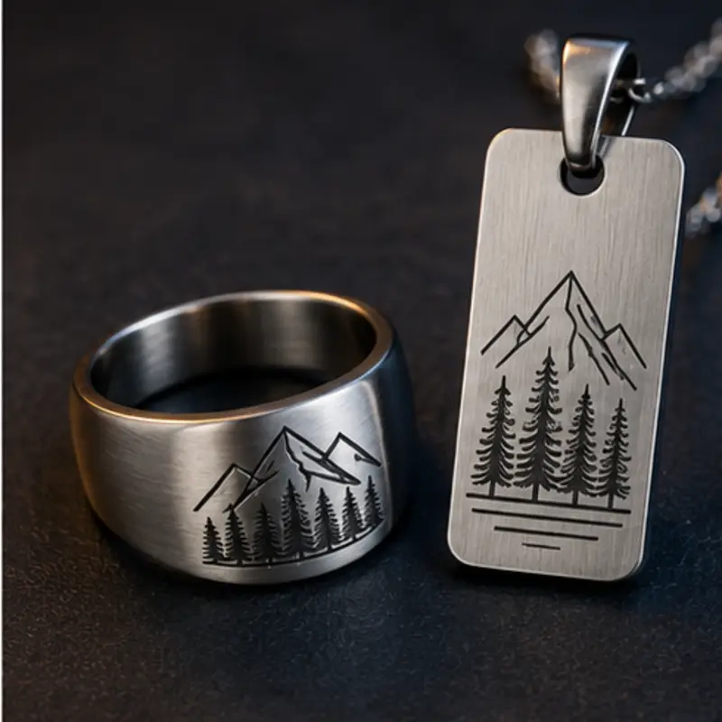 Stainless-steel ring and pendant with precision engraved landscape designs