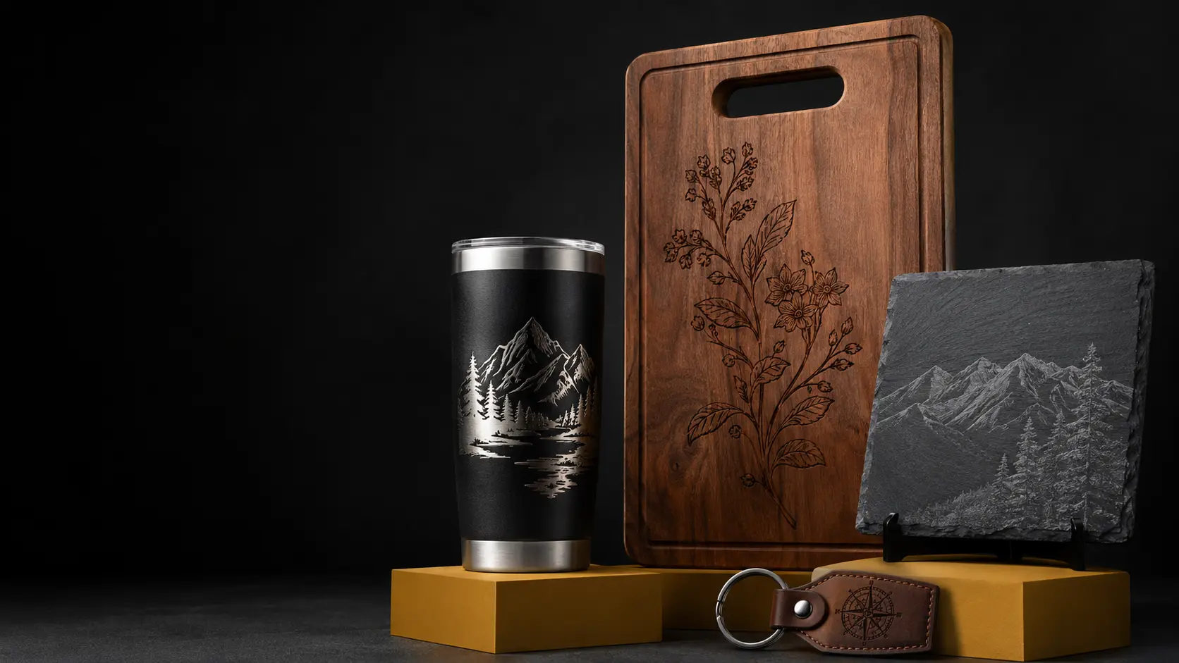 Laser-engraved tumbler, cutting board, slate plaque, and leather keychain